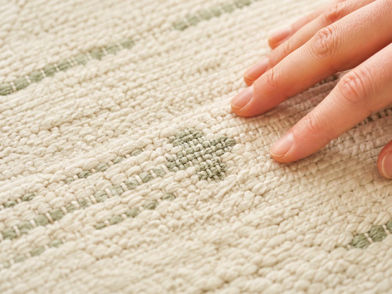 Macro close-up of the woven organic cotton pile of a Little Woven rug